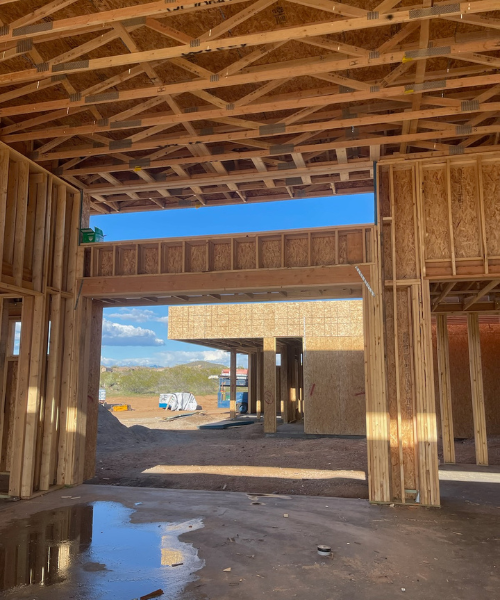 A house under construction with a lot of wood framing