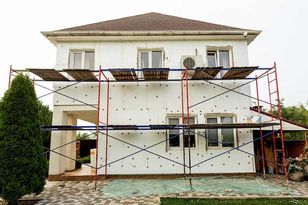 A house with scaffolding on the front of it