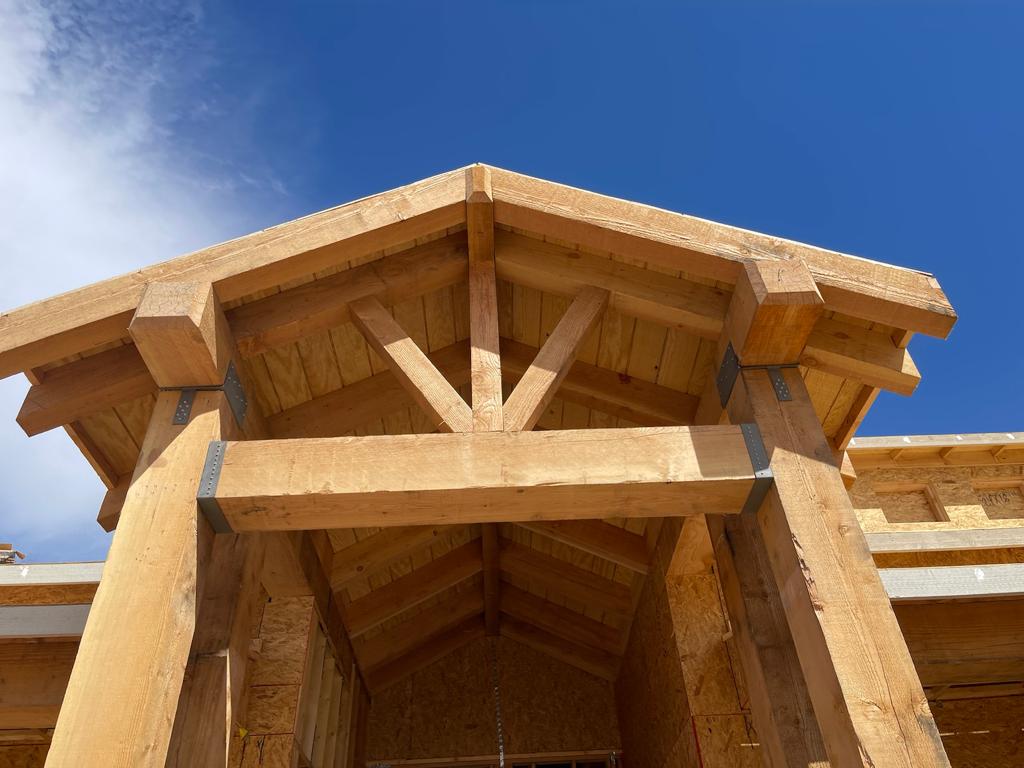 A wooden structure with a sky background