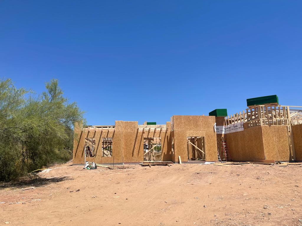 A house under construction in the middle of the desert